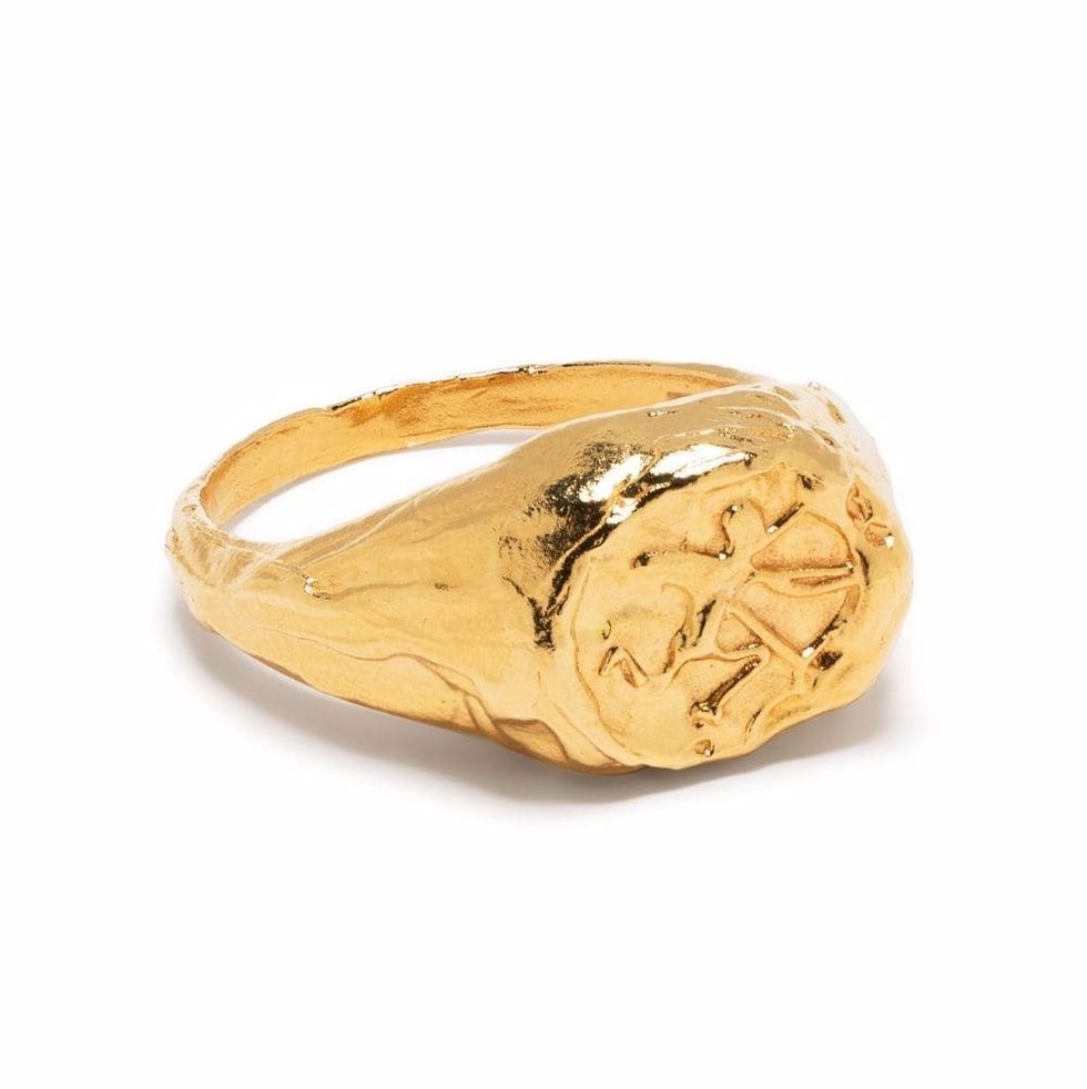 a gold ring with a diamond