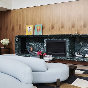Inarc Architects living room a living room with a marble fireplace