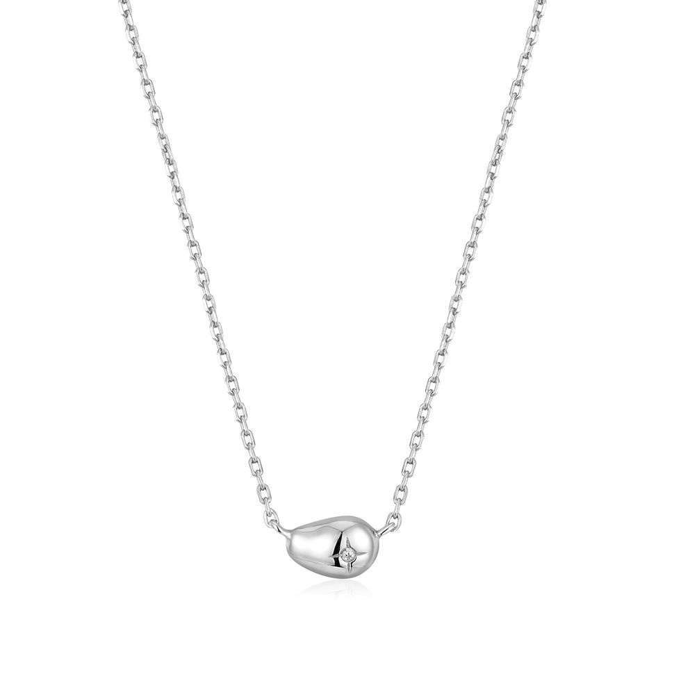 a silver chain with a diamond pendant