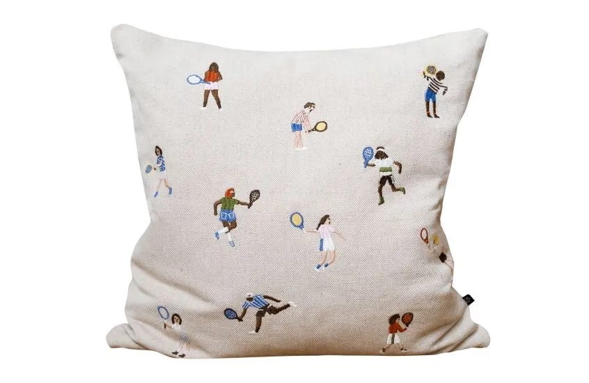 decorative pillow featuring tennisthemed illustrations