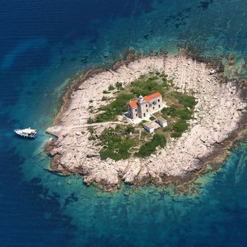 a small island with a house on it
