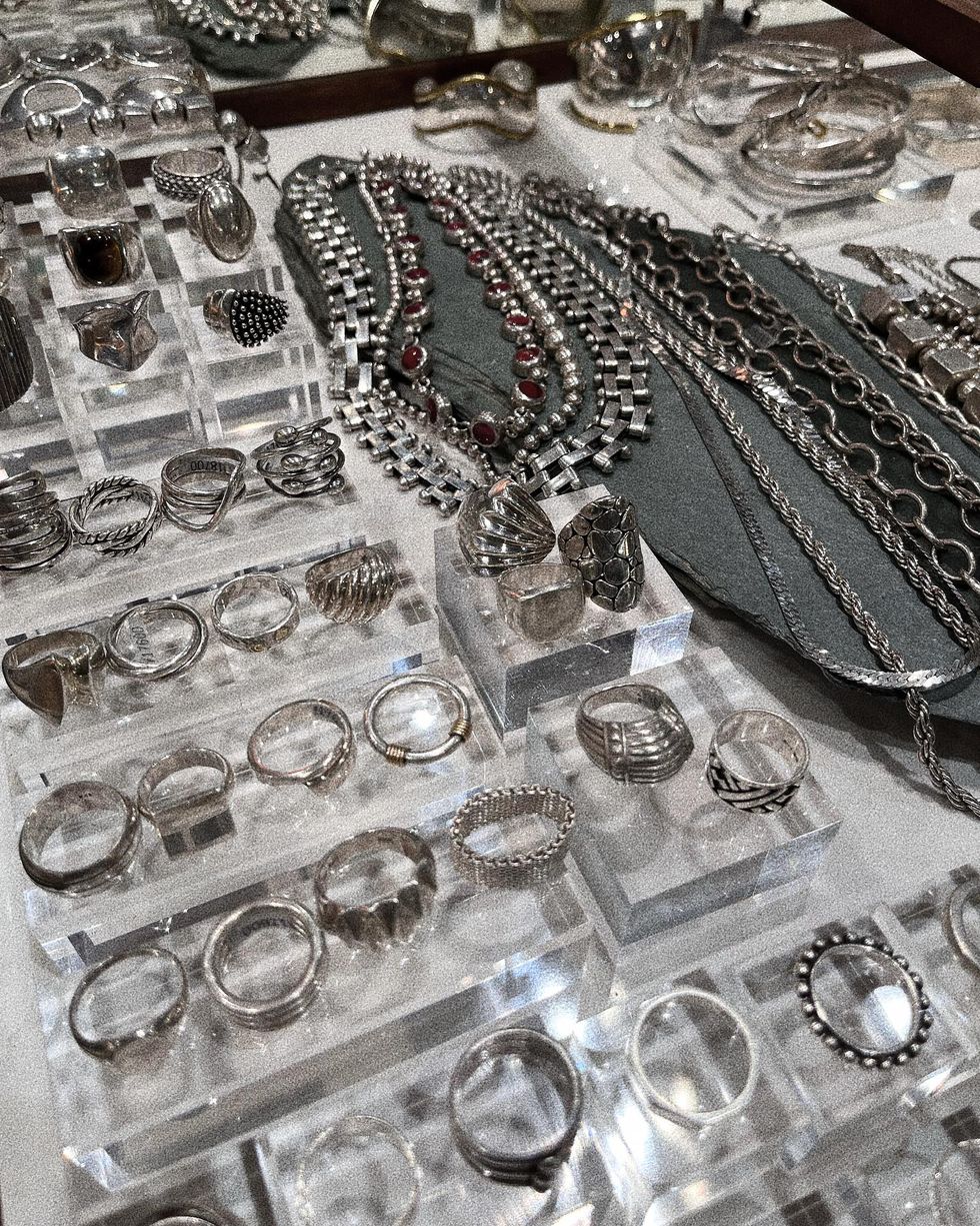 a table full of jewelry