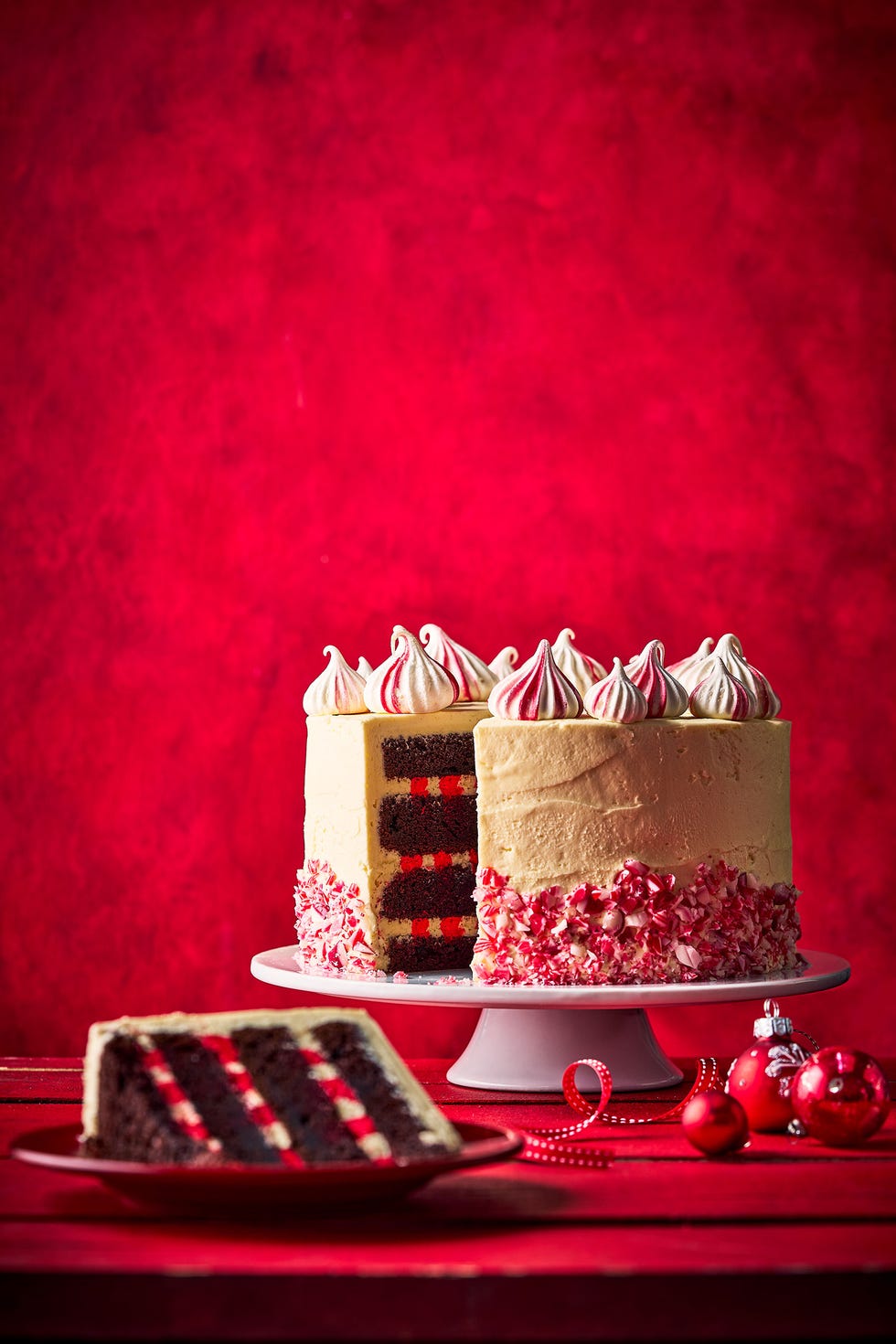 a large chocolate cake on a table with a slice taken out
