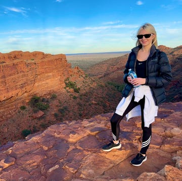 nathalie whittle standing on a rock surveying a canyon in australia northern territories nathalie whittle standing on a rock surveying a canyon in australia northern territories