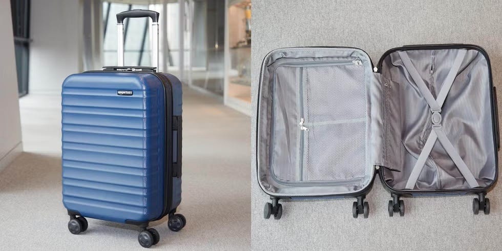 an amazon basics suitcase upright and lying open in a hallway