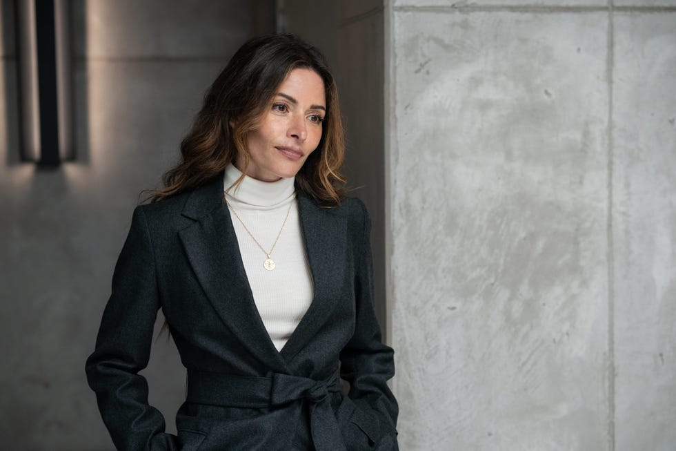 professional attire with a focus on a blazer and turtleneck combination