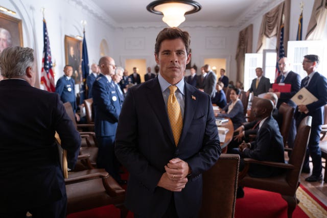 meeting in an official setting with multiple attendees discussing a matter of importance