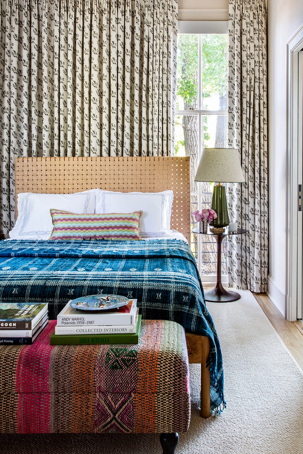 Stylish bedroom showcasing a bed decorative textiles and natural lighting stylish bedroom showcasing a bed decorative textiles and natural lighting