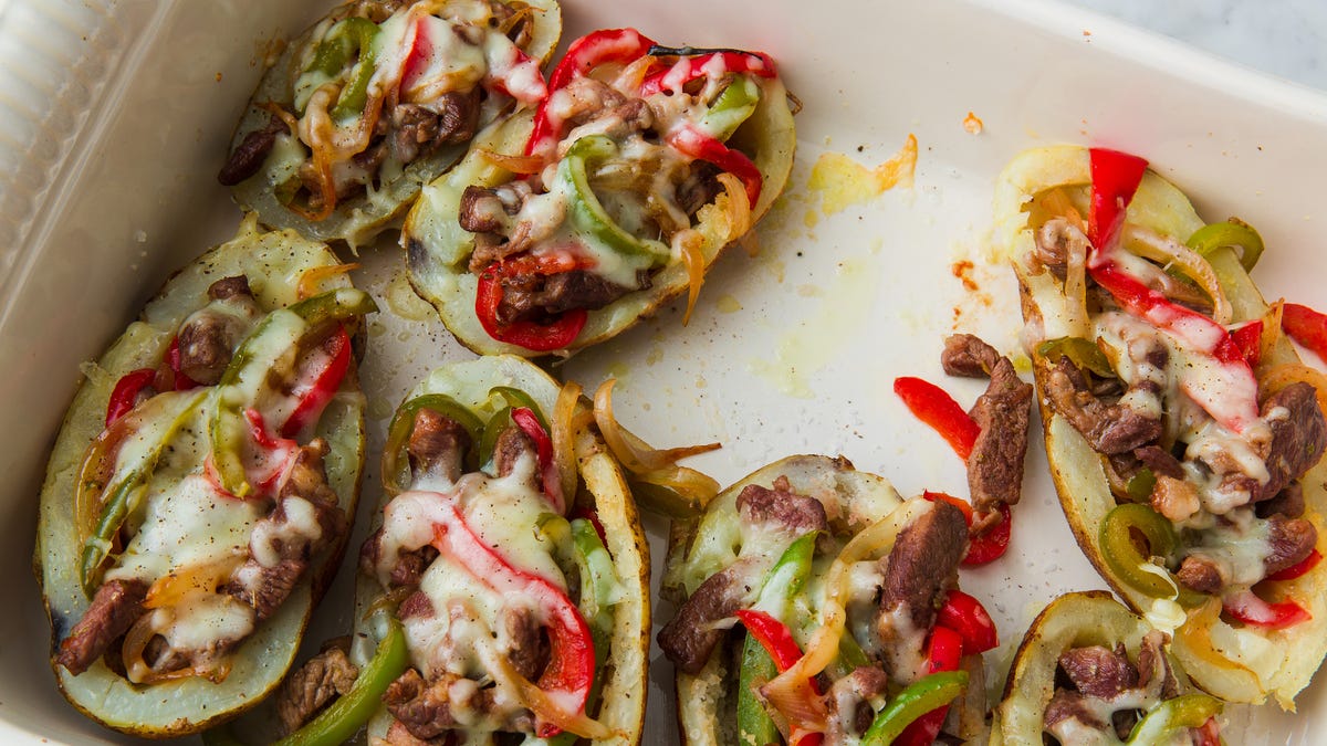 Video player poster image preview for We Can't Get Enough Of These Cheesy Potato Skins