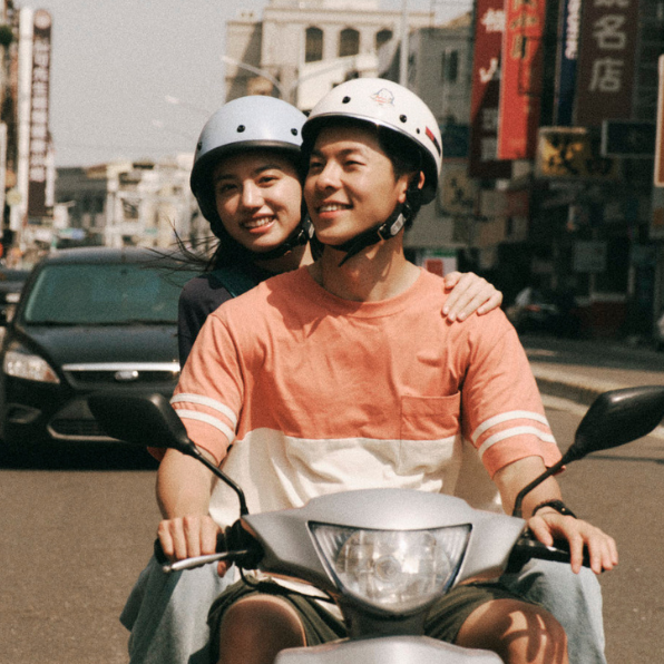 a group of people on a scooter