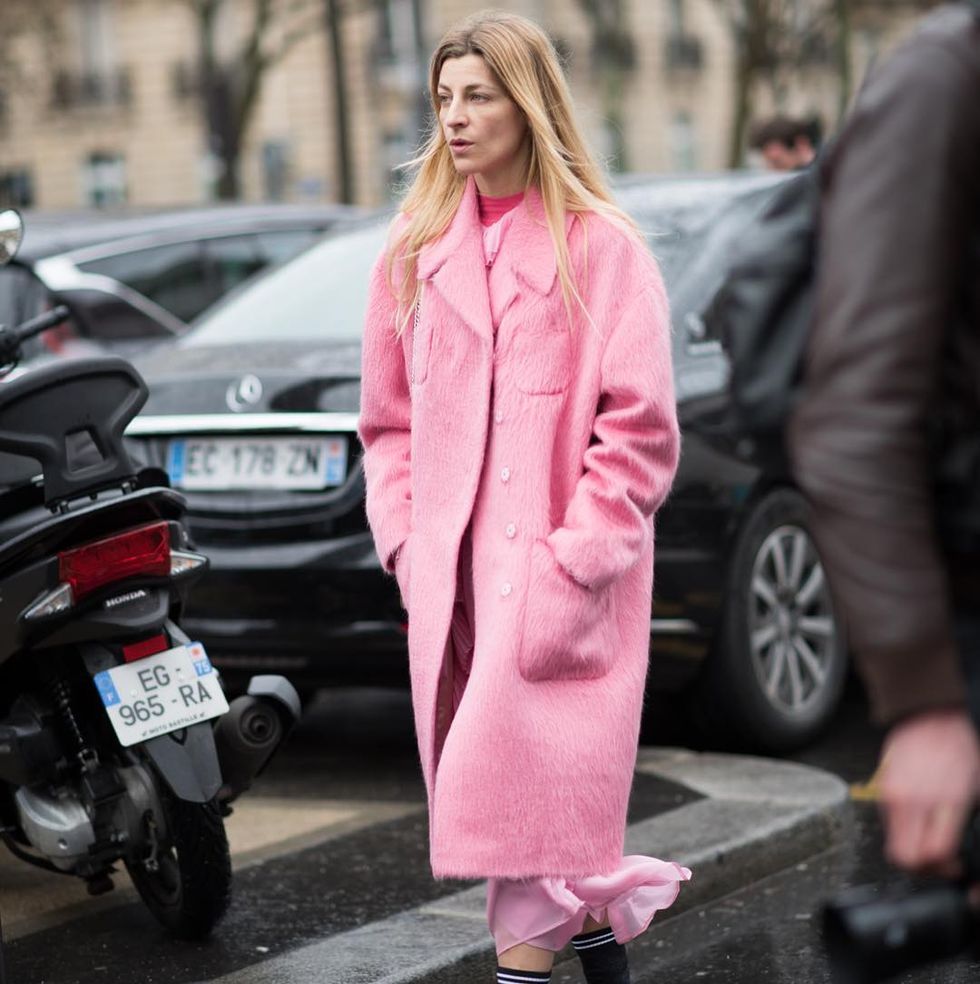 a woman in a pink coat