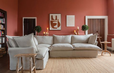 beige sofa in pink room