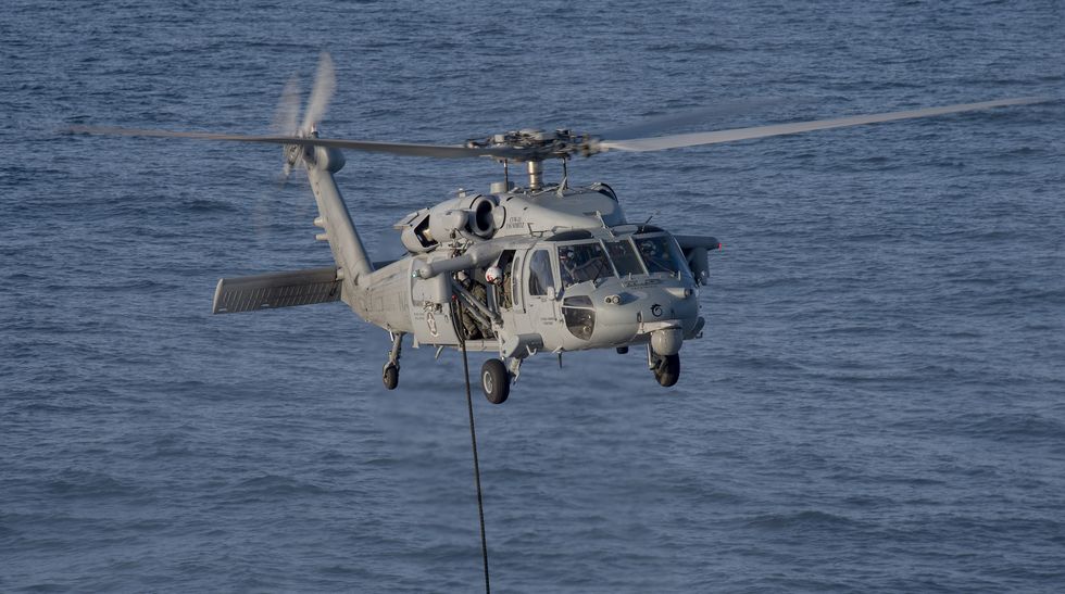 an mh 60s seahawk, assigned to helicopter sea combat squadron hsc 8, conducts a helicopter visit, board, search, and seizure hvbss training exercise with a range support craft rsc 1 in the pacific ocean off the coast of san diego, april 16, 2015 hsc 8 provides vertical lift search and rescue, logistics, anti surface warfare, special operations forces support, and combat search and rescue capabilities for carrier air wing 11 cvw 11 in support of the uss nimitz cvn 68 and carrier strike group 11 csg 11 operations us navy photo by mass communication specialist 2nd class daniel m youngreleased