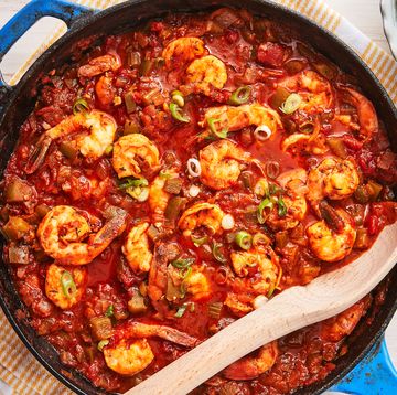 shrimp creole in red sauce and green scallions