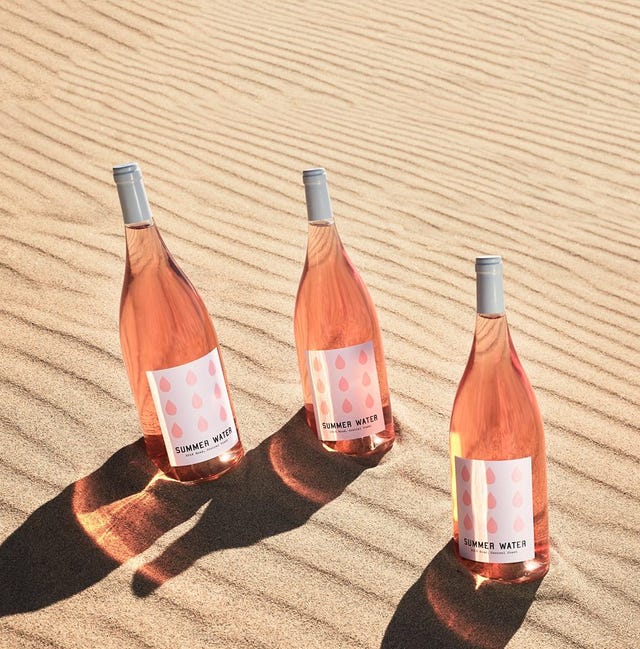 Wine bottle, Bottle, Glass bottle, Orange, Drink, Water, Alcohol, Distilled beverage, Liqueur, Wine, 