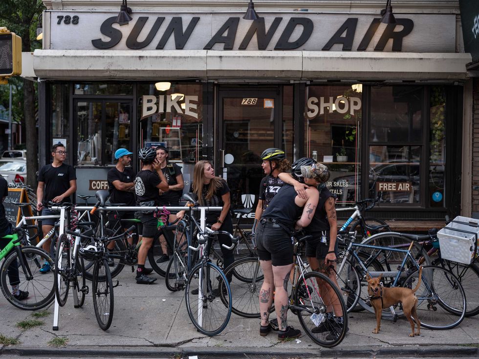 Friends of Robyn Hightman gather outside Sun and Air bike shop in Brooklyn, NY on Saturday, August 24, 2019