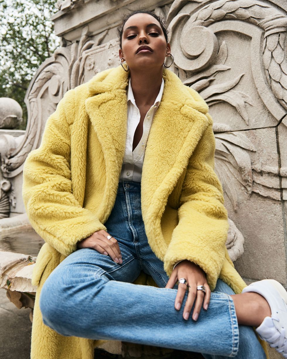 A model in a yellow fur coat