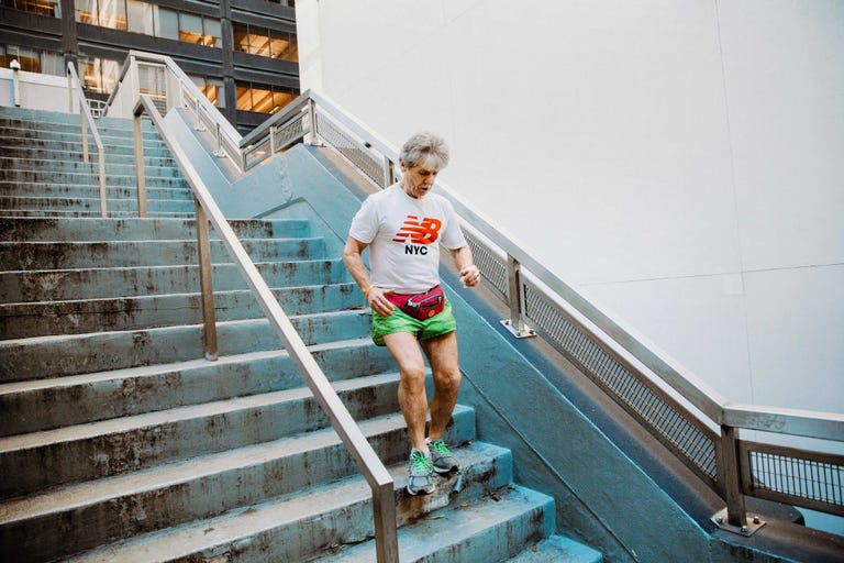 Tom McGrath running down the stairs in New York City near the Black Sheep bar in December 2019.