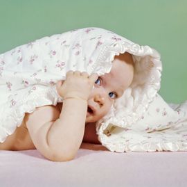 1960s baby hiding under...