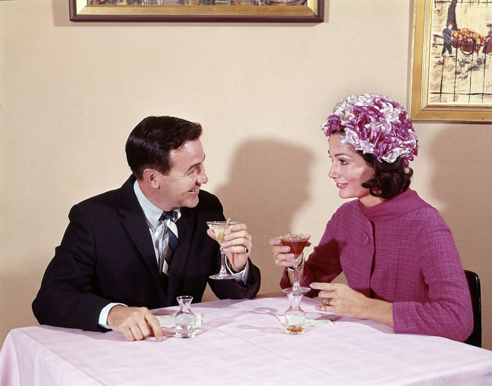 1960s COUPLE DRINKING...