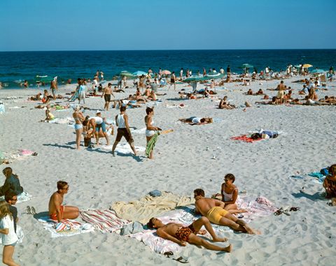 1960s PEOPLE ON BEACH...