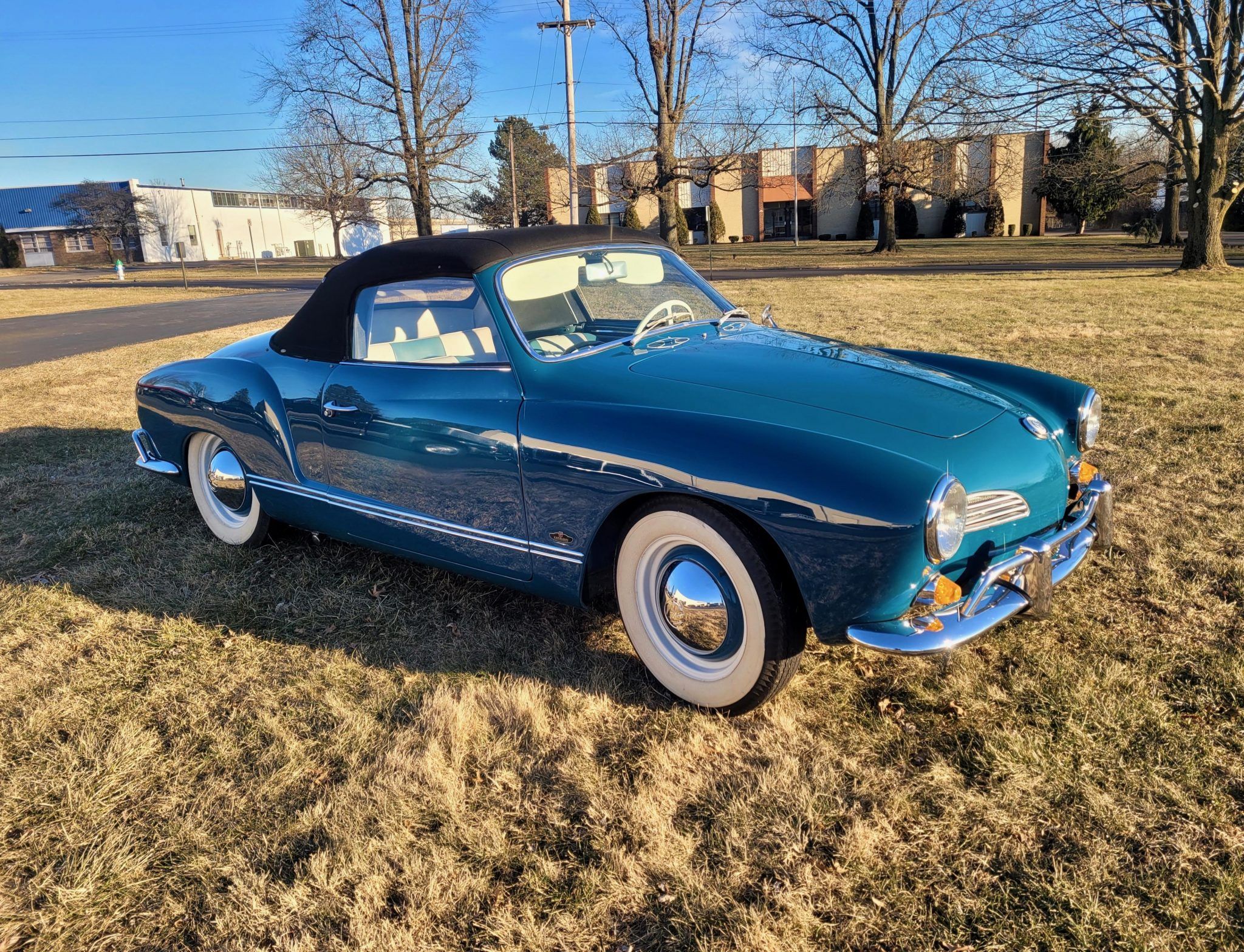 What pale blue older style (50's, 60's, or 70's) convertible