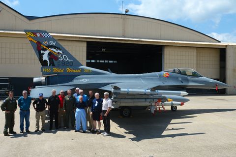retired us air force wild weasel pose for a photo with present wild weasels in front of the newly unveiled 20th fighter wing flagship f 16cm fighting falcon at shaw air force base, sc, june 5, 2015 the was recently painted with a wild weasel scheme on the tail for the 50th anniversary of the wild weasels us air force photo by senior airman jonathan bassreleased