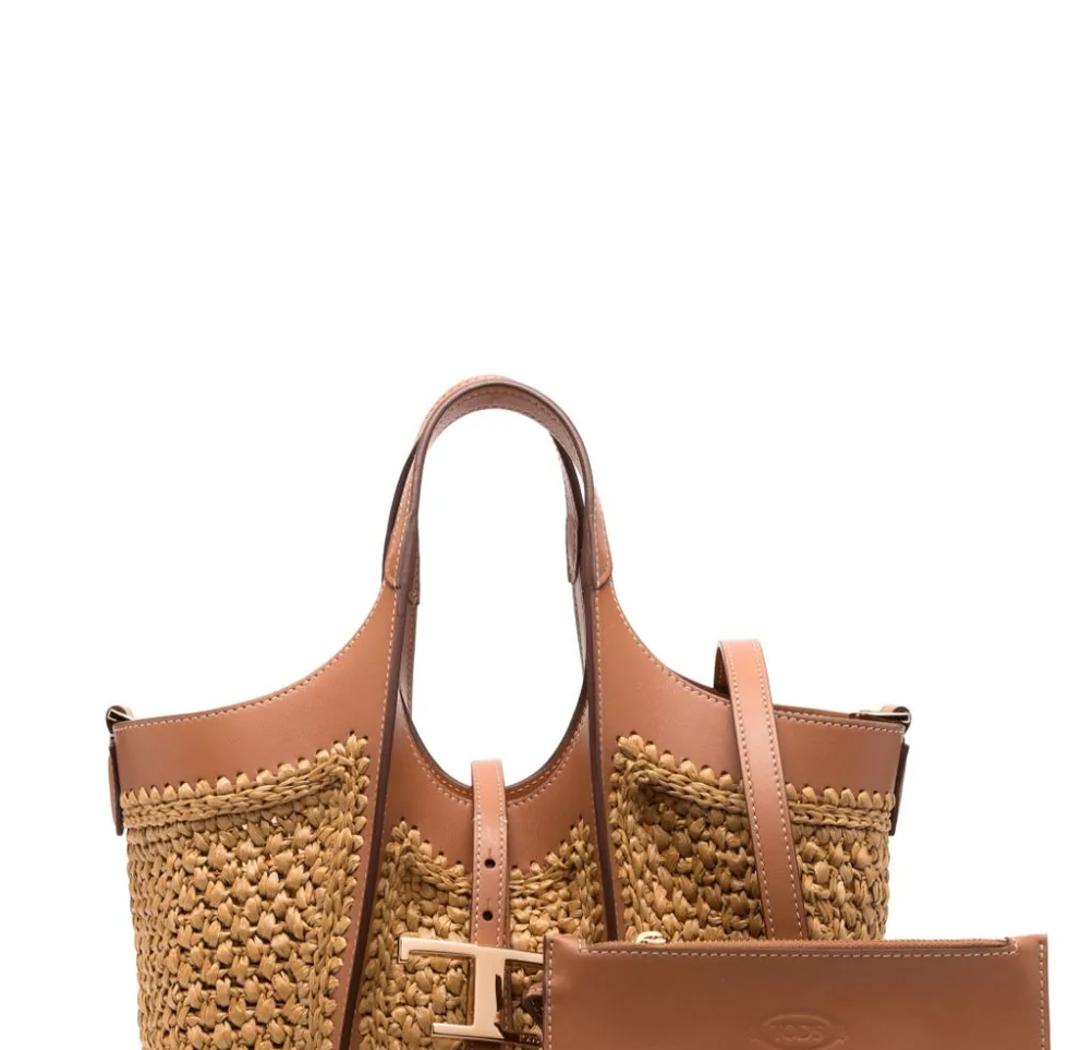a brown purse with a brown leather strap
