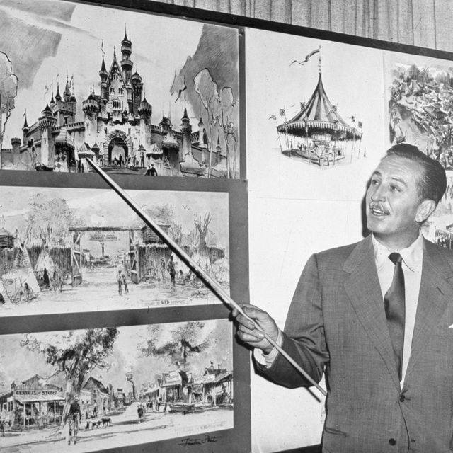 american producer, director, and animator walt disney uses a baton to point to sketches of disneyland