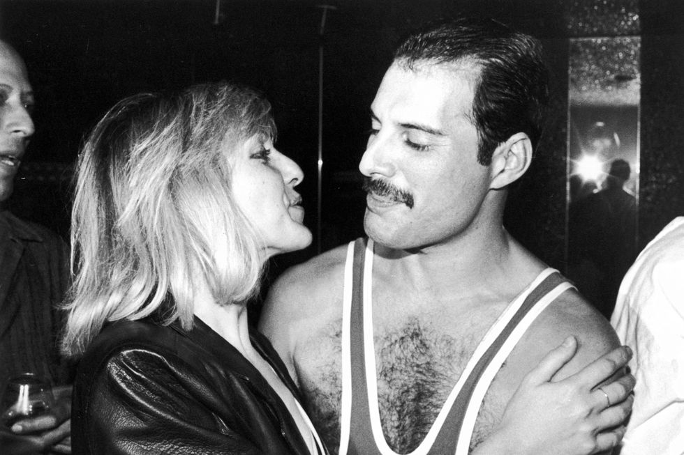 Freddie Mercury (1946 - 1991) of British rock band Queen with his friend Mary Austin, during Mercury's 38th birthday party at the Xenon nightclub, London, UK