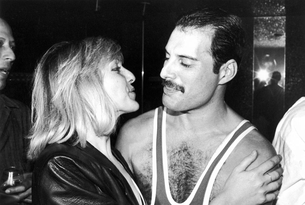 Freddie Mercury (1946 - 1991) of British rock band Queen with his friend Mary Austin, during Mercury's 38th birthday party at the Xenon nightclub, London, UK