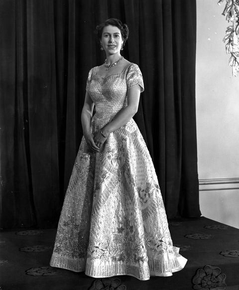 queen elizabeth ii wearing a gown designed by norman hartnell for her coronation ceremony