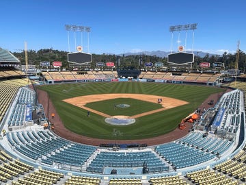 a baseball stadium with a blue sky