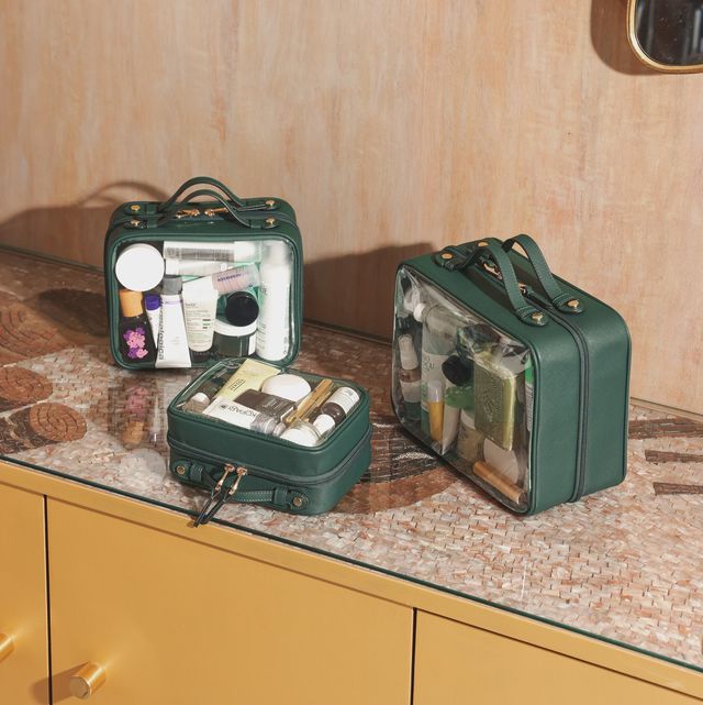 a group of green suitcases on a counter
