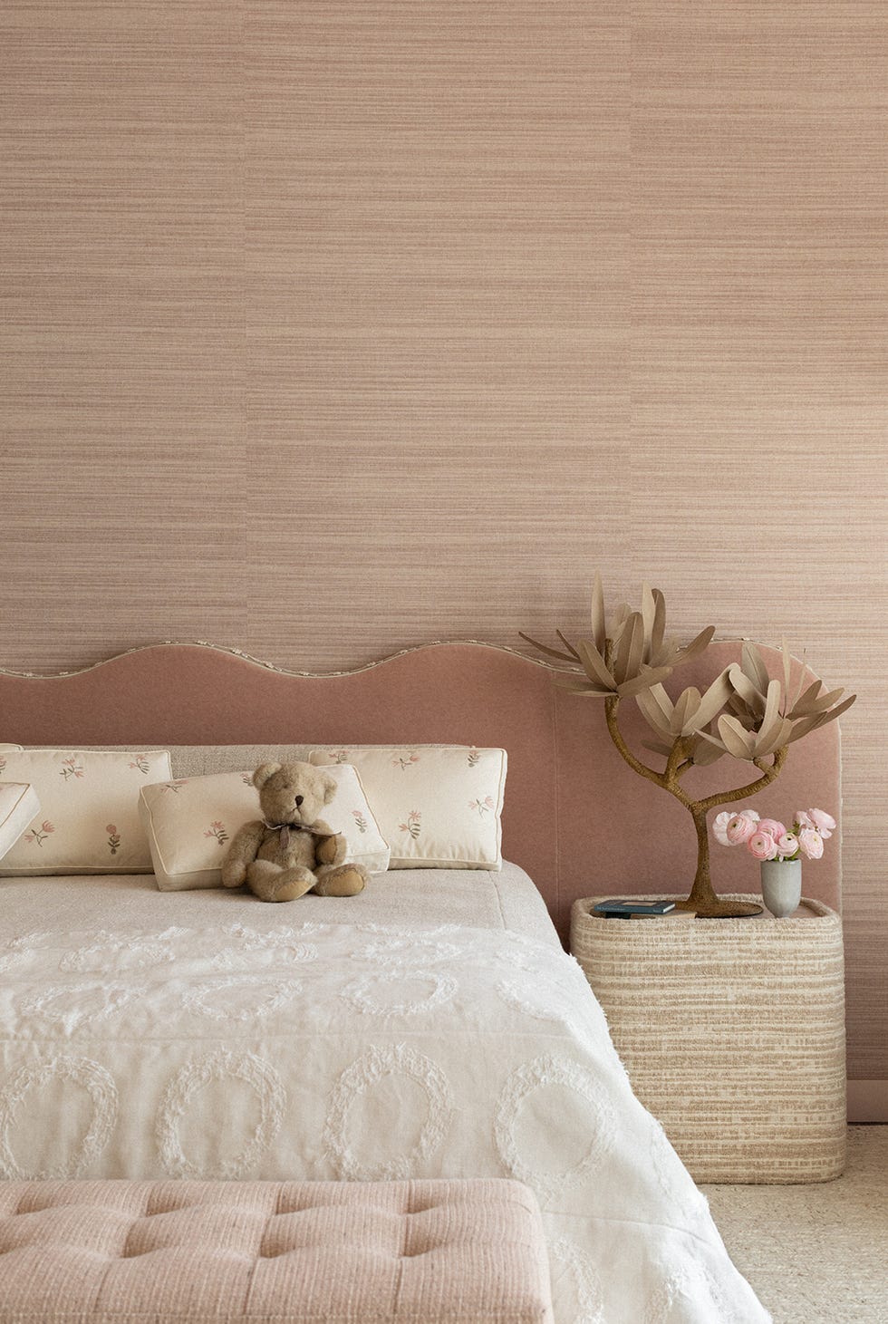 pink bedroom with curvy headboard