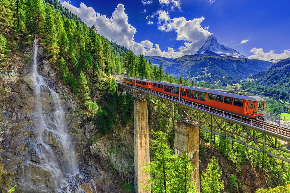 Transport, Nature, Train, Mountainous landforms, Railway, Mountain, Rolling stock, Vehicle, Mountain range, Natural landscape, 