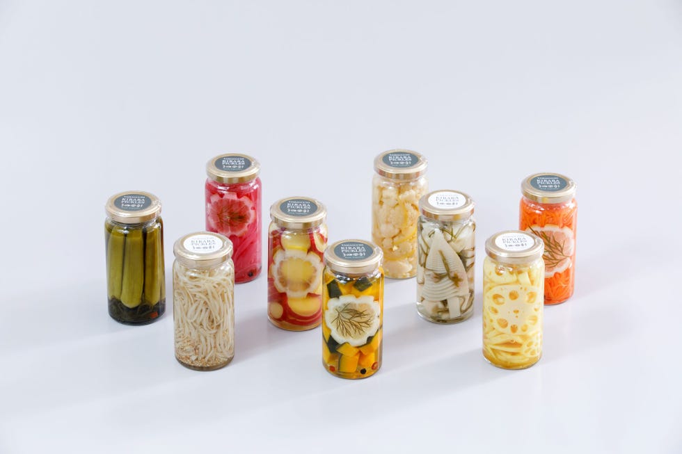 a group of jars with different colored liquid in them