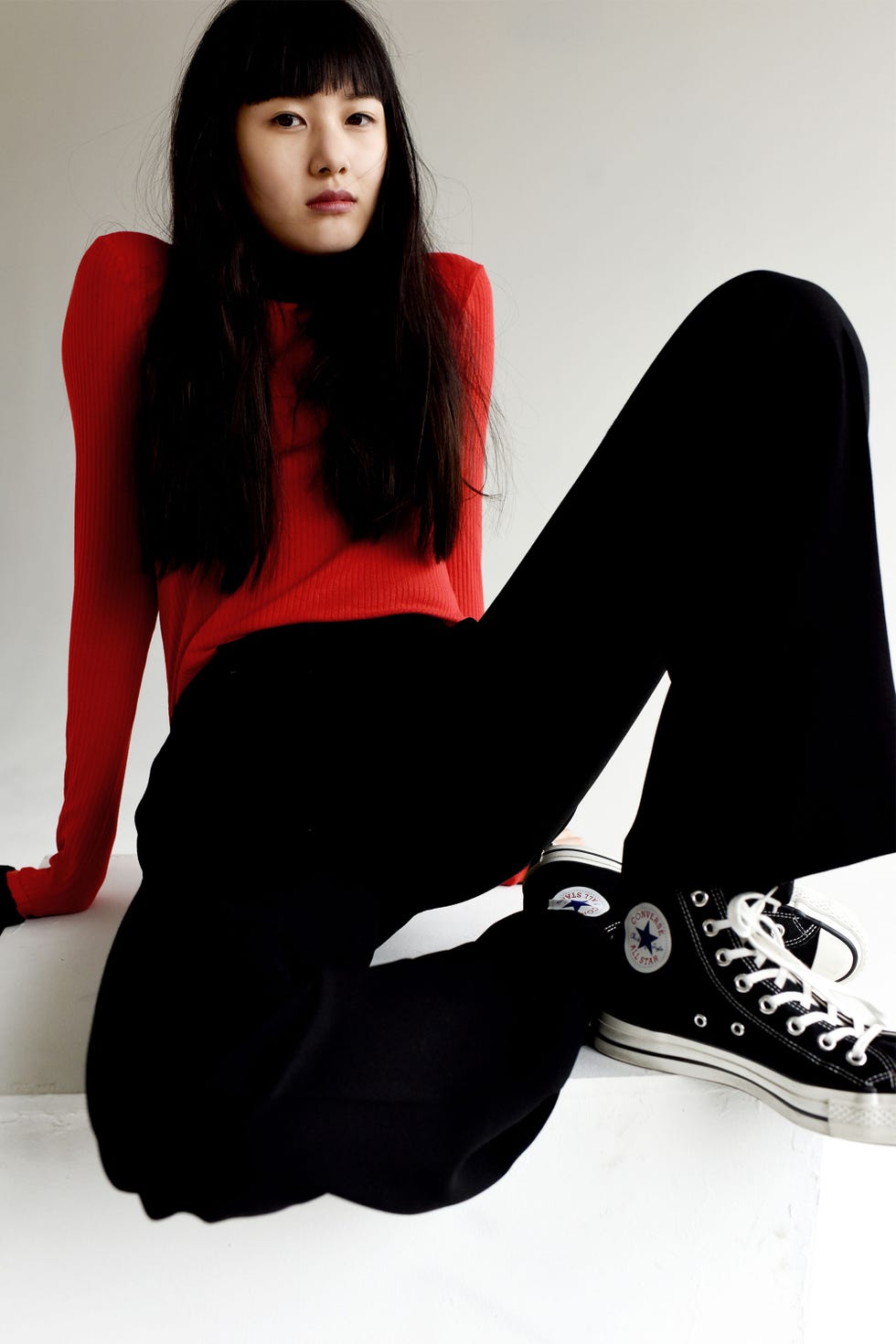 Black, Sitting, Red, Leg, Lip, Tights, Footwear, Leggings, Photo shoot, Black hair, 