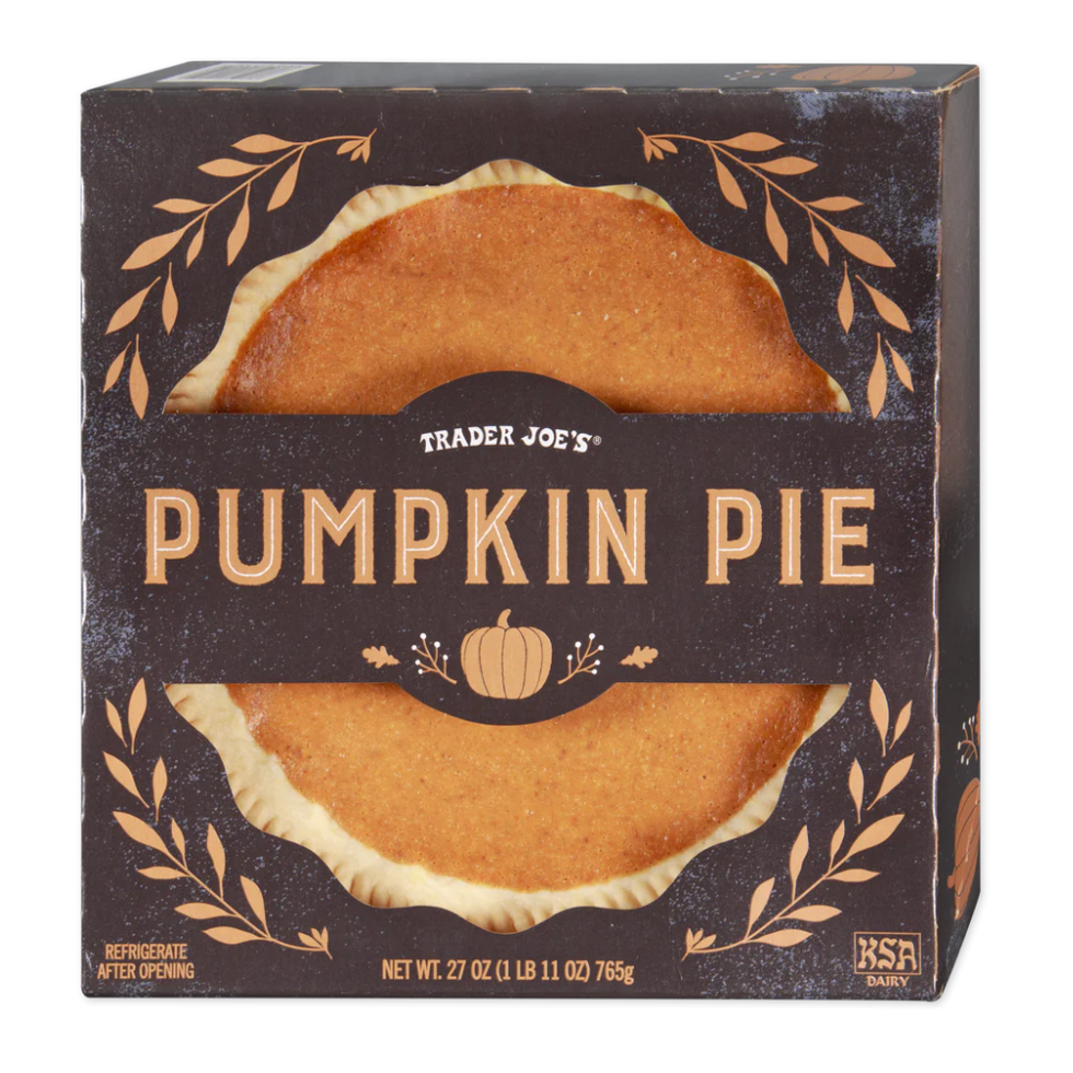 packaging for trader joes pumpkin pie featuring a round pie visible through clear plastic