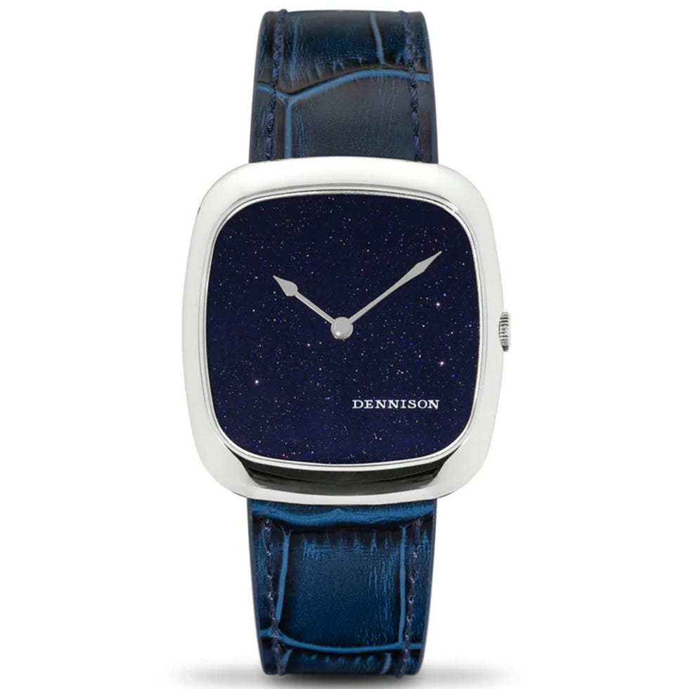 a watch featuring a starry nightthemed dial with a blue leather strap