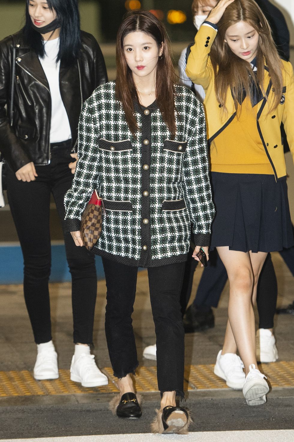 kwon eun bi, ahn yoo jin, kim min joo of izone poses for pictures after he arrived at incheon international airport on october 26th in incheon, south korea photoosen