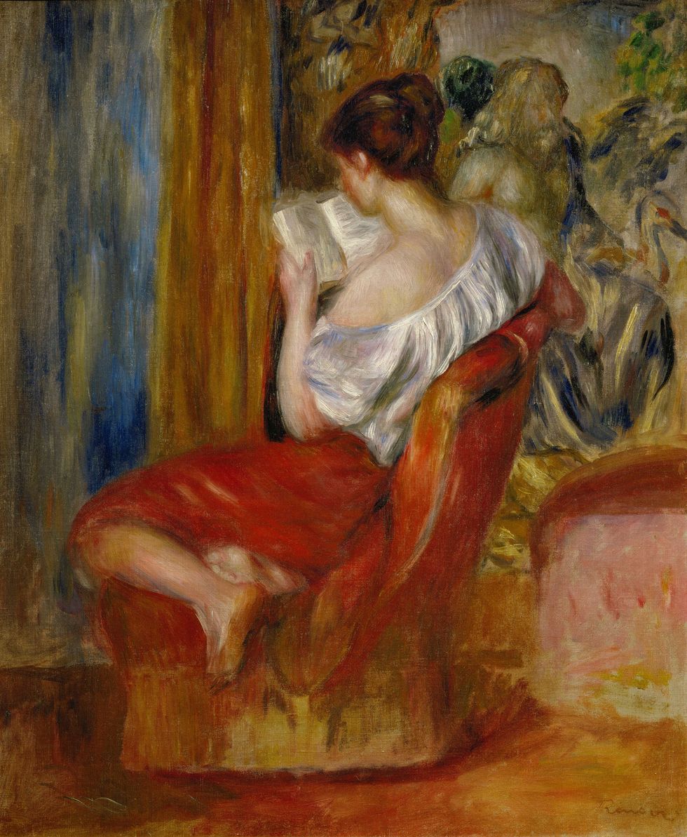 a woman lounging reading