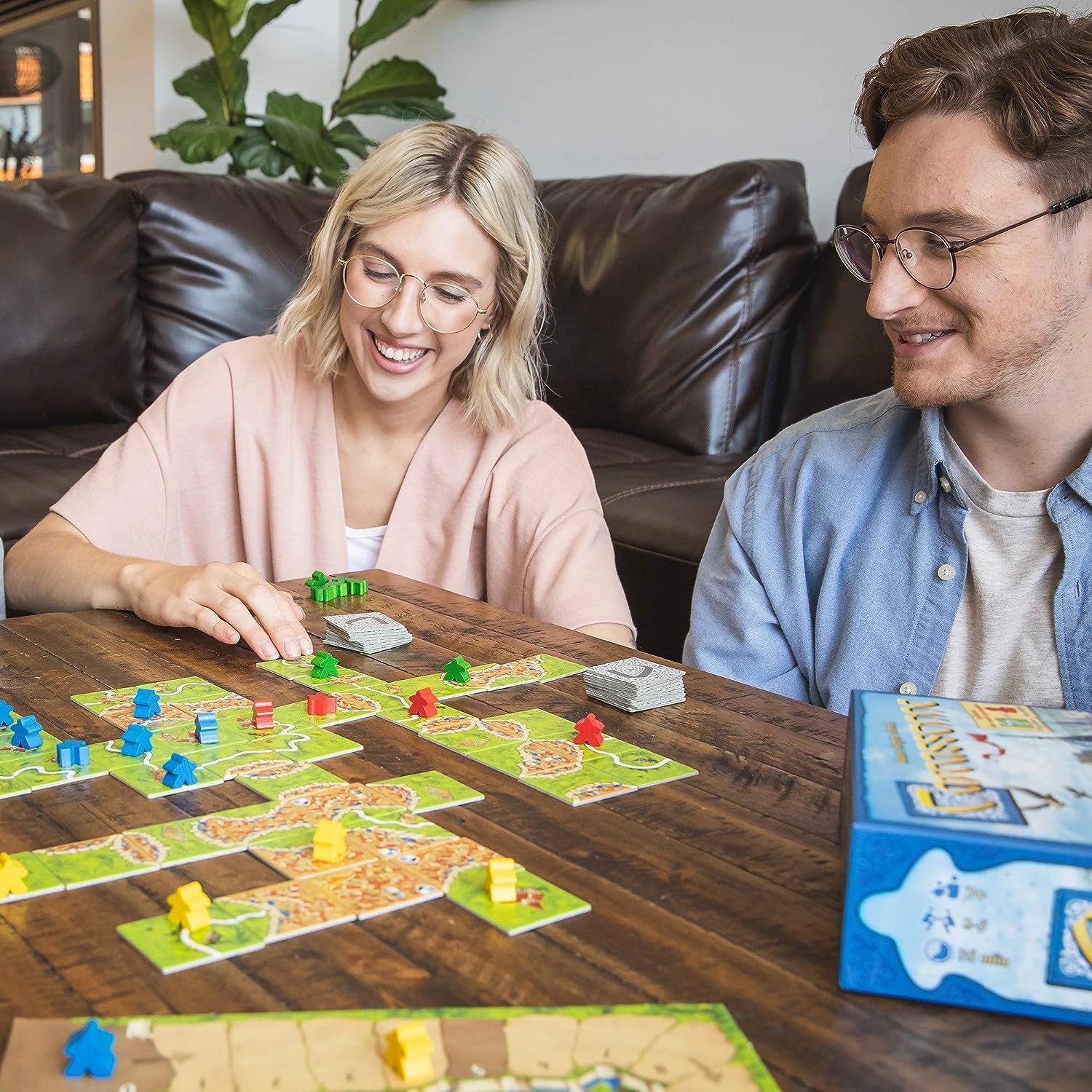 young people playing board games