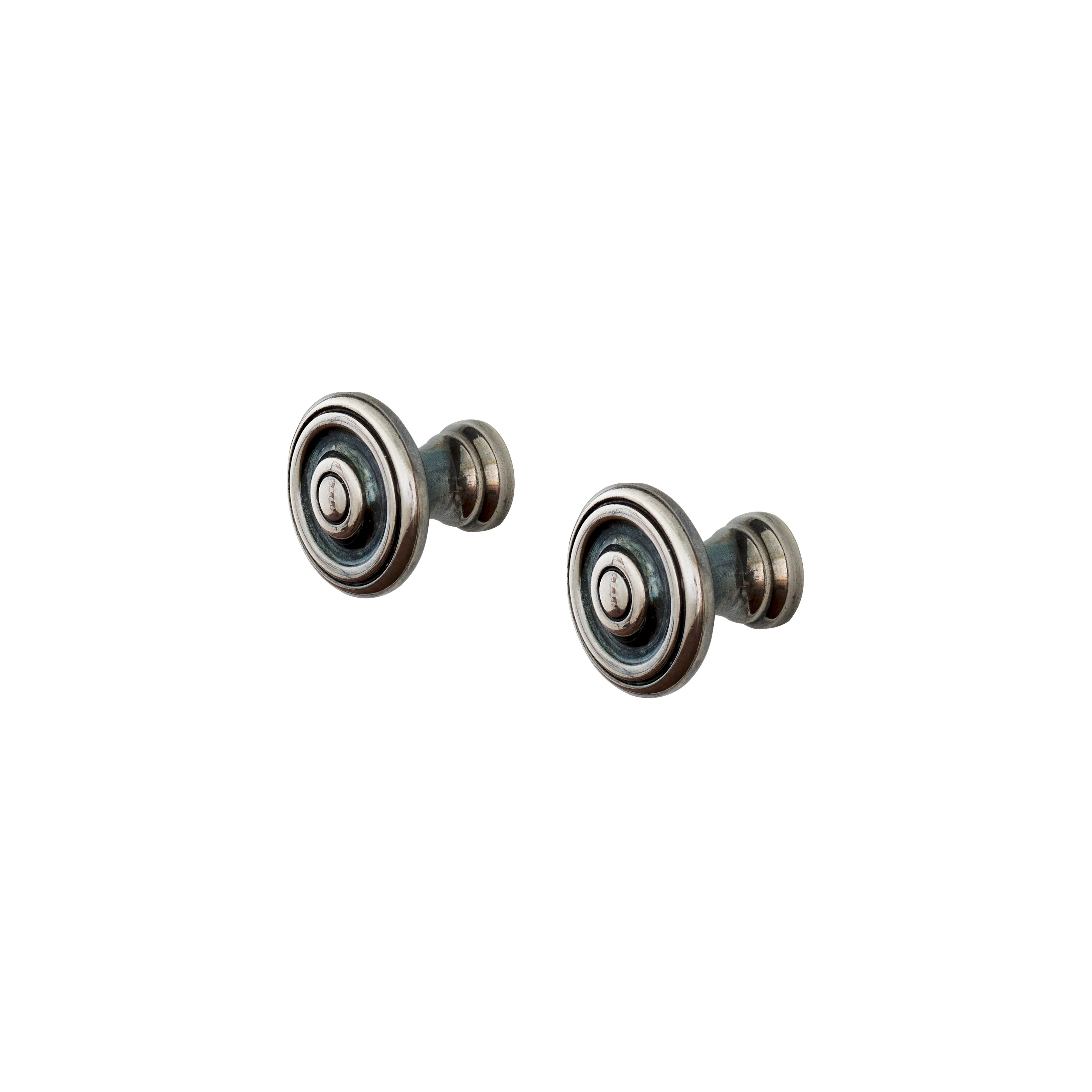 a pair of round and silver knobs