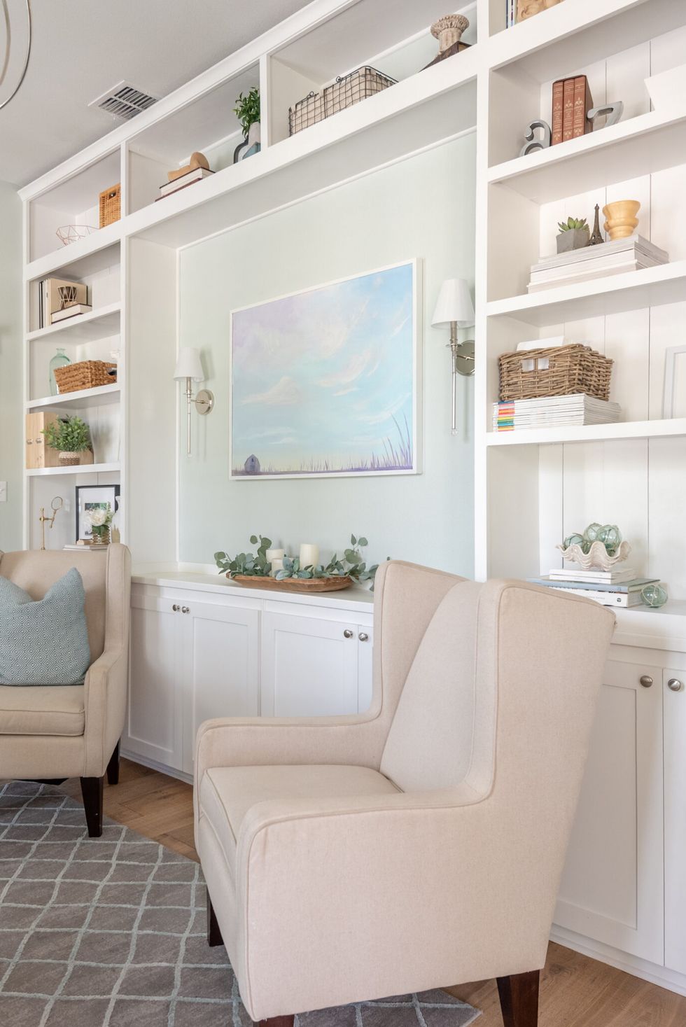 white room with white shelves and chairs