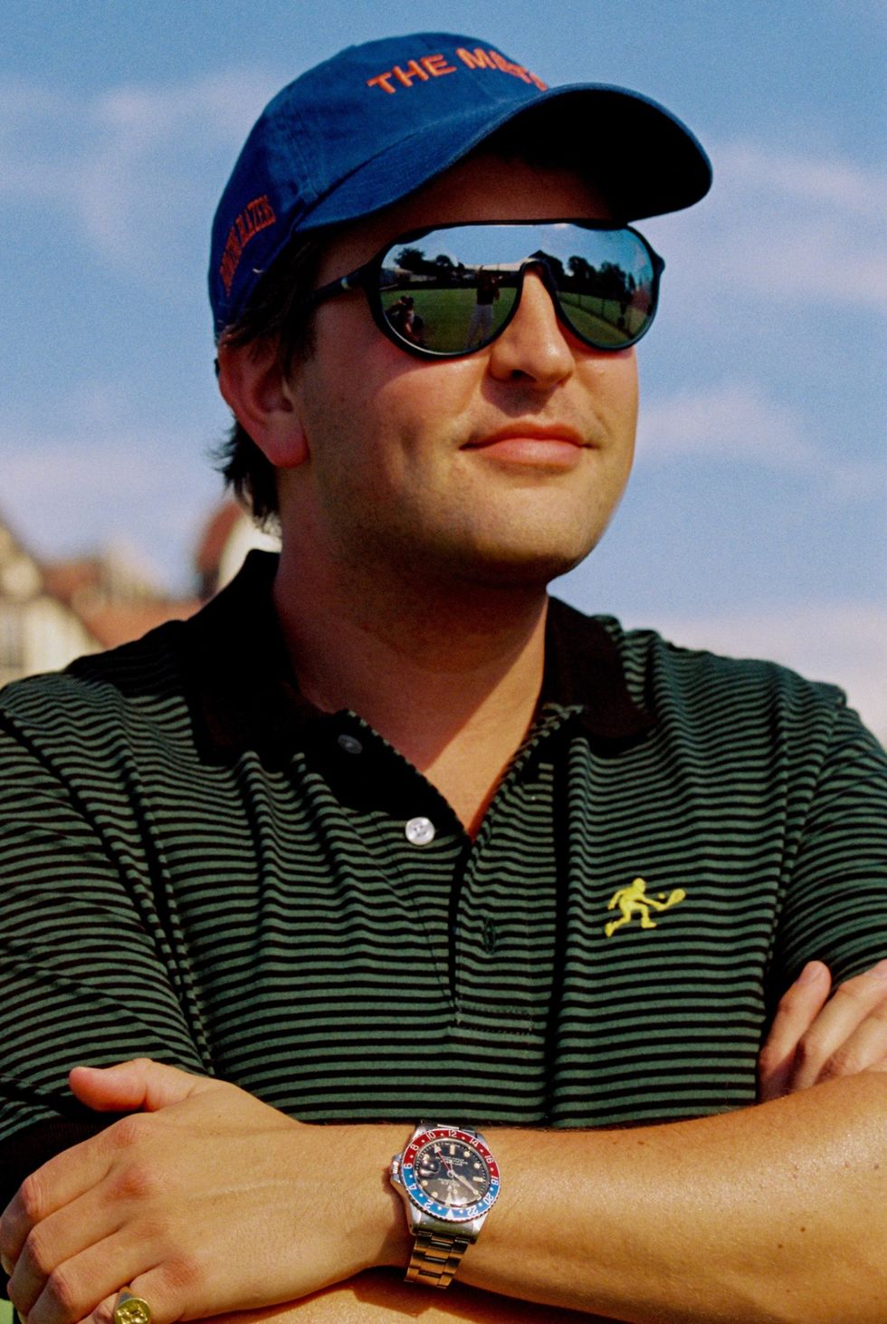 a man wearing sunglasses and a hat