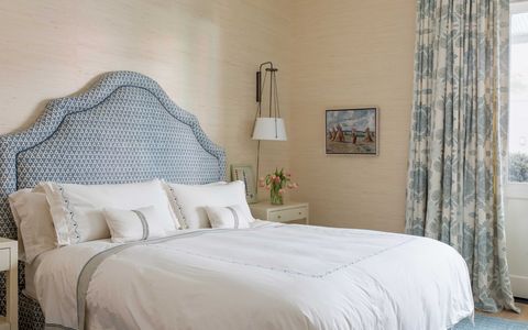main bedroom, master bedroom, blue headboard, white and blue curtains