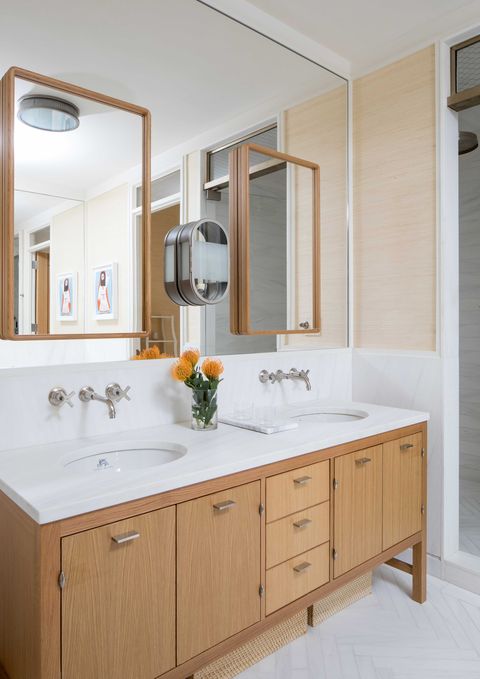 wooden bathroom cabinets, white marble countertops, double sinks