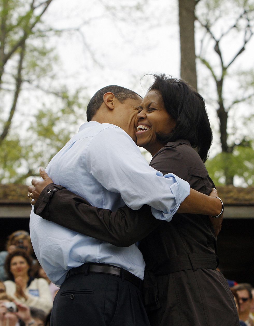 democratic presidential candidate us senator barack obama hugs his wife michelle while meeting families during a picnic at a park in noblesville, indiana, may 03, 2008  afp photoemmanuel dunand photo credit should read emmanuel dunandafp via getty images