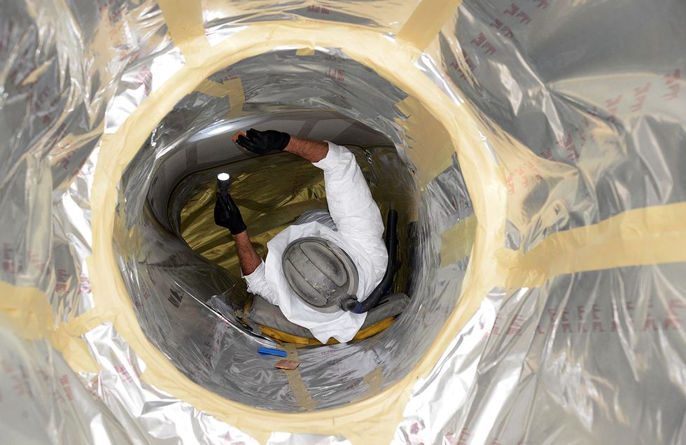 a 574th aircraft maintenance squadron low observable technician, gap fills the inside of the engine nacelle of an f 22 raptor at hill air force base, utah, nov 24, 2020 the squadron processed 247 f 22s through the f 22 structural repair program by performing structural modifications to increase total flying hour serviceability on each aircraft by 8,000 hours us air force photo by alex r lloyd